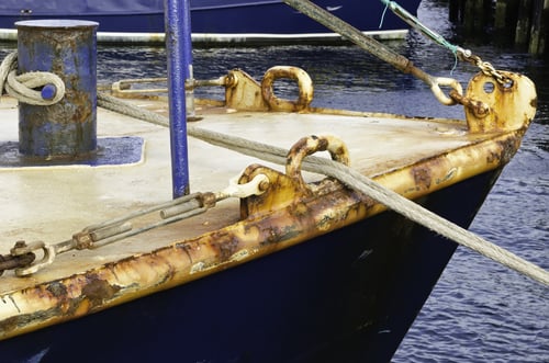Rust at a glance Oxidizing bow of fishing trawler in harbor